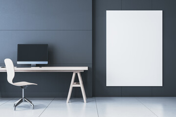 Modern minimalistic black interior with workplace and computer monitor, white mock up banner on wall. 3D Rendering.