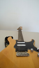 a classic wood-colored electric guitar