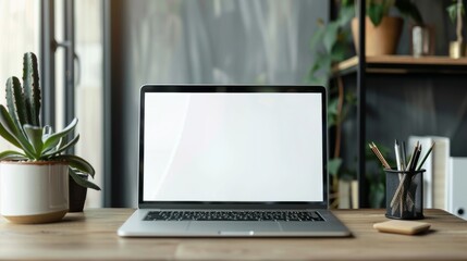 Minimalist workspace desk with laptop and supplies, copy space, business concept, blank screen laptop, office essentials