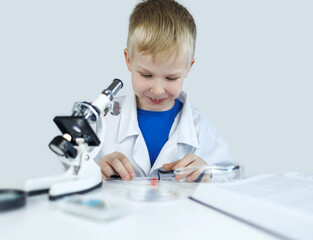 Child chemist. Teacher shows a visual experiment. A science mentor teaches an experimental...