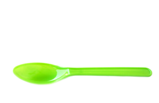 Green plastic disposable spoons isolated on white background. Concept, equipment for eating utensil, can be reuse or recycle to made DIY craft.     