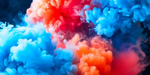 Dynamic ink swirls of orange and blue blending in fluid motion.