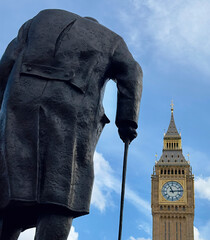 Rear view of the statue of Sir Winston Churchill in Parliament Square overlooking Big Ben in...