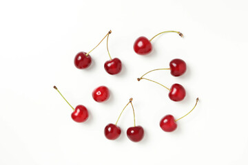 Ripe juicy cherry fruits on a white background