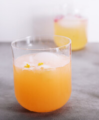 Glasses of orange juice with ice cubes
