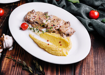 Stewed pork neck in sauce. Served with mashed potatoes