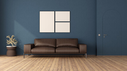 Blue living room with leather sofa and frameless door