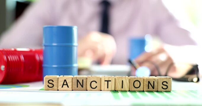 Oil dealer sales manager considers profit or financial loss from oil and gas sanctions. Hand of politician or diplomat shows embargo sanction