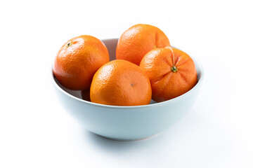 Fresh tangerines in bowl isolated on white background
