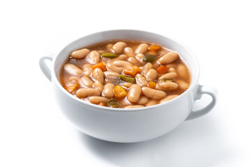 White beans soup with vegetables in white bowl isolated on white background. 