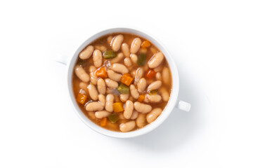 White beans soup with vegetables in white bowl isolated on white background. Top view