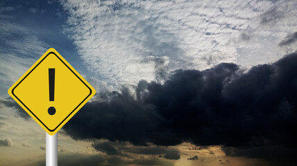 Hurricane season with symbol sign against a stormy background and copy space. The dirty and angled sign adds to the drama.