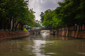 Tranquil Canal Scene with Footbridge in Bangkok, Thailand