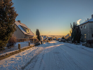 Snowy, frosty and sunny winter morning in European village