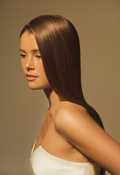 Side View of Young Woman with Glossy Straight Hair
