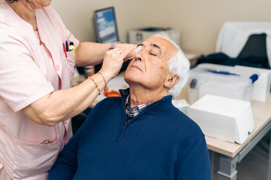 Pre-treatment care includes administering drops to a patient's eye.