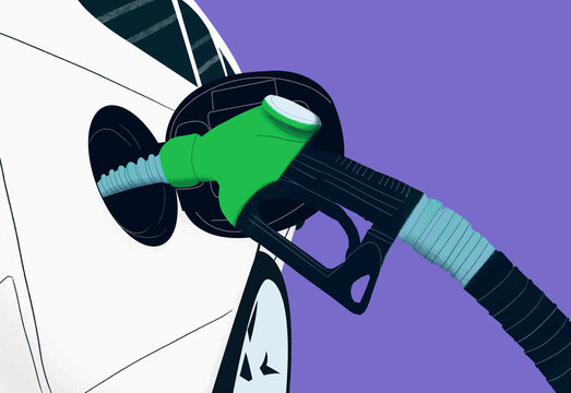 Close up green biofuel gas pump fueling car
