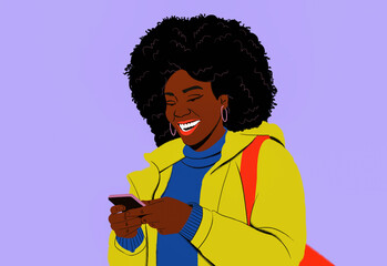 Happy young woman with afro texting with smart phone
