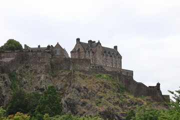 Fototapeta na wymiar Edinburgh Castle. A view of Edinburgh Castle from Princes Street Gardens, Edinburgh. The castle located on Castle Rock dates back to the 11th century.