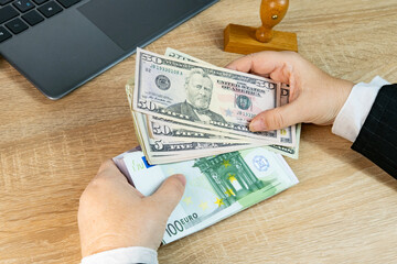 Close-up of female bank employee's hands counting euro, dollar bills, paper money, Forex Analysis,...