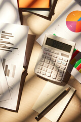 Desk with calculators for calculating, managing and analyzing economic profits and losses.