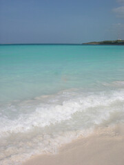 Turquoise sea water and blue sky on a beach in Little Exuma Island, Bahamas.