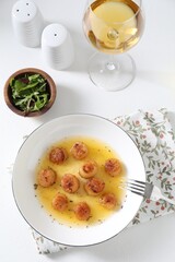 Delicious fried scallops served on white table, flat lay