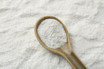 One spoon on baking powder, closeup view