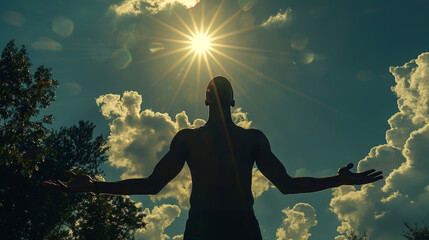 Silhouette of a black man holding the sun