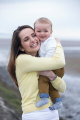 Mother and baby at the beach.