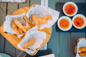 Delicious fried shrimps served with sauces on the restaurant table, Portugal