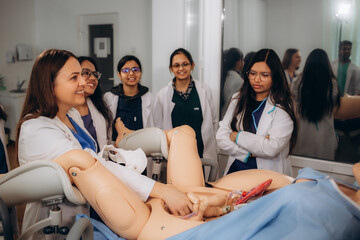 future gynecologists learn how to give birth by working with a mannequin