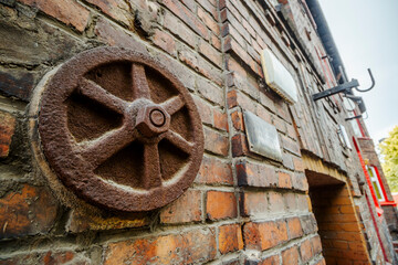Metal rusted ankra protects house from damage on wobbly post-mining land, Katowice, Silesia, Poland
