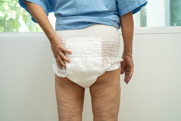 Asian senior woman patient wearing incontinence diaper in hospital, healthy strong medical.