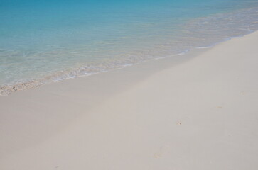Fototapeta na wymiar Soft blue ocean wave or clear sea on clean sandy beach 