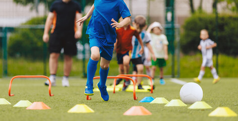 Kids in physical education training. Children play sports drill on training equipment