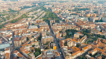 Fototapeta na wymiar Milan, Italy. Industrial and residential areas. Access railway tracks to Milano Porta Garibaldi Train Station, Aerial View