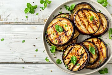 Slices of grilled eggplants in plate on wooden table - obrazy, fototapety, plakaty