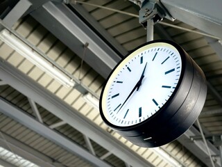 Clock at the sky train platform in low angle.