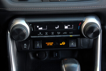 Car climate control. SUV climate control panel. Car interior with climate-control view. Vehicle air conditioning system.