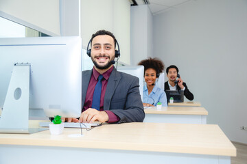 Obraz premium Customer service, call center or telemarketing team and manager or mentor looking happy reading online feedback or sale on website. Diversity people, support sales consultant training office