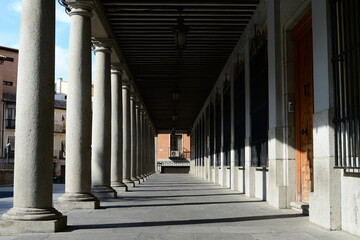Arcades and columns in the Plaza de Zocodover in Toledo, Spain.