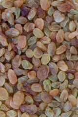 Top View of Golden Raisin Background with Copy Space in Vertical Orientation