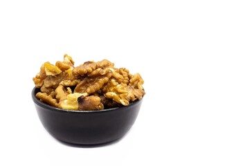 Walnut Dried Fruit in a Black Bowl Isolated on White Background with Copy Space in Horizontal Orientation, Healthy Eating and Lifestyle Food Concepts