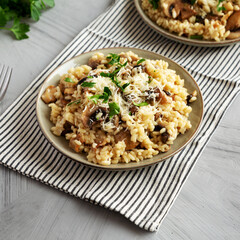 Homemade One-Pot Bacon And Mushroom Risotto on a Plate, side view.