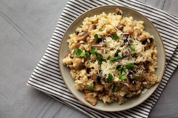 Homemade One-Pot Bacon And Mushroom Risotto on a Plate, overhead view. Flat lay, top view.