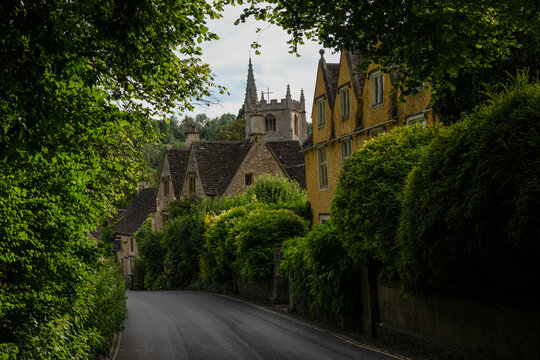 View Of Beautiful Stone Village Through Lush Greenery In The English Countryside