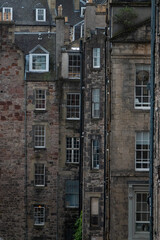CLOSE UP: Diversity of stone facades of tall townhouses in historic Edinburgh
