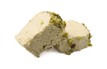 Pieces of tasty halva with pistachios on white background