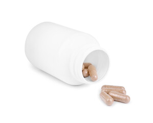 Vitamin capsules and medical bottle isolated on white